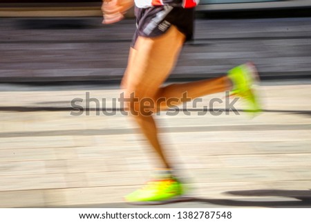 Runner during a foot race in a moving photo