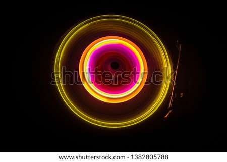 Music Dj concept. Trail of fire and smoke on vinyl record. Burning vinyl disk. Turntable vinyl record player on dark background. Selective focus