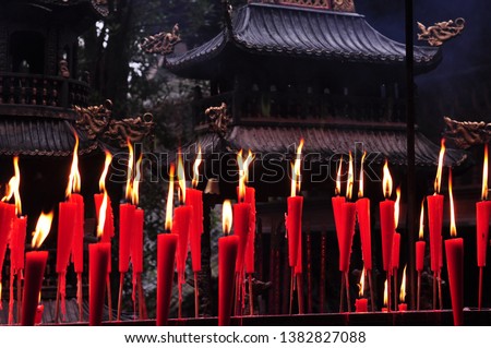Incense burner filled with candles in Qingcheng Mountain, Sichuan.represents the good wishes of people