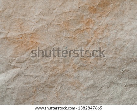 Textured background of rough crumpled wrapping paper