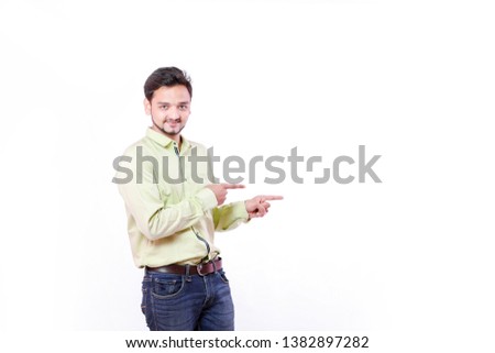 Young Indian man showing on white background