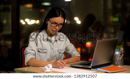 Female designer drawing sketches looking laptop, educational online lesson