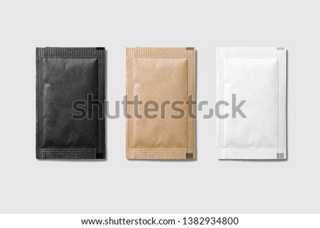 Set of various sugar packet isolated on light grey background - High resolution. Royalty-Free Stock Photo #1382934800