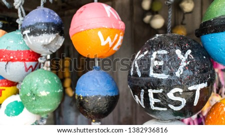 Key West painted white on a black a crab trap styro foam float ball in the southern most city of Florida and the United States