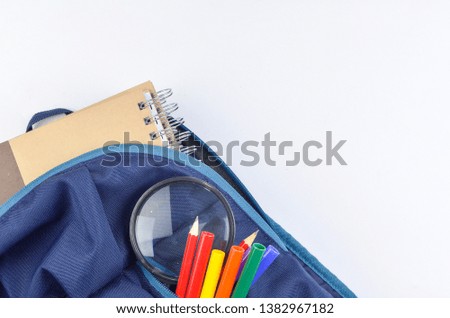 View of flat lay with school backpack and stationery with space for text on white background. Selective focus.