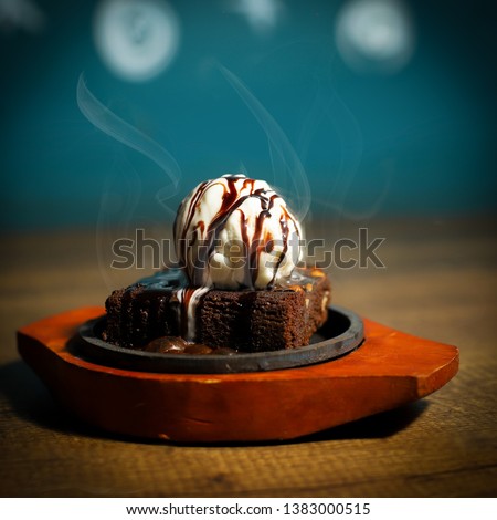sizzling With Ice cream topping  Royalty-Free Stock Photo #1383000515