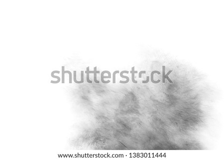Black particles splatter on white background. Black powder dust burst. 