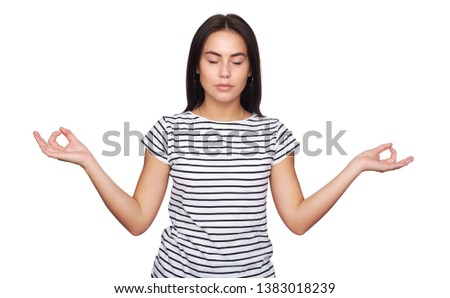 Yoga and meditation. Pretty girl is trying to keep calm. Brunette woman isolated on white background