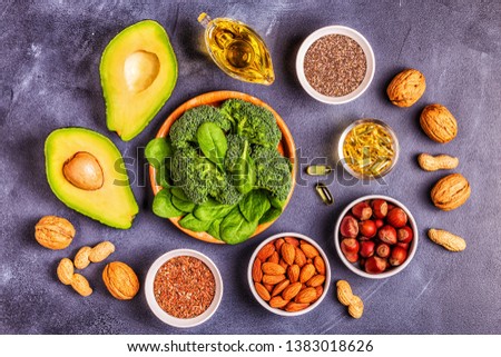 Vegan sources of omega 3 and unsaturated fats. Concept of healthy food. Top view. Royalty-Free Stock Photo #1383018626
