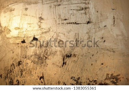 Abstract background. Window chaotically smeared with paint, illuminated by the sun.