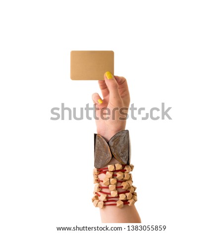Female hand holding a blank
 golden business card.