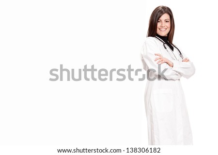 Photo of brunette doctor with white message board - isolated