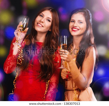 Portrait of happy young friends with cocktails