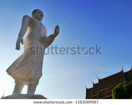 A white sculpture Buddha in temple Thai