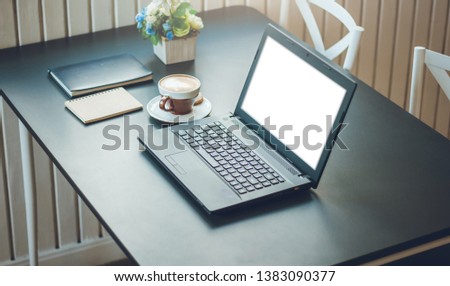 Working place with laptop, notebook, coffee on table, retro style