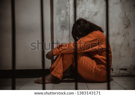 Hands of women desperate to catch the iron prison,prisoner concept,thailand people,Hope to be free,If the violate the law would be arrested and jailed. Royalty-Free Stock Photo #1383143171