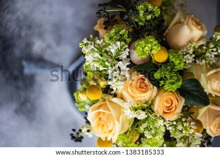 Floral weddinf gift concept with box full of roses on grey background