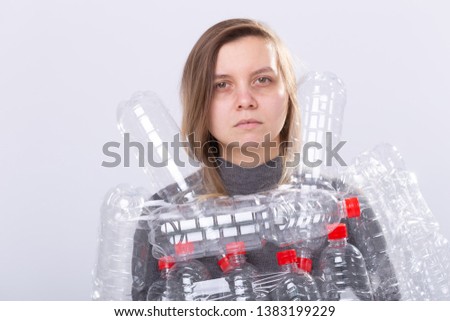 Plastic pollution problem and environment protection. Weak tired woman with plastic bottles. Save Earth concept. Clean our nature.