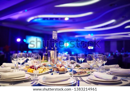 a large hall with laid tables awaits guests Royalty-Free Stock Photo #1383214961