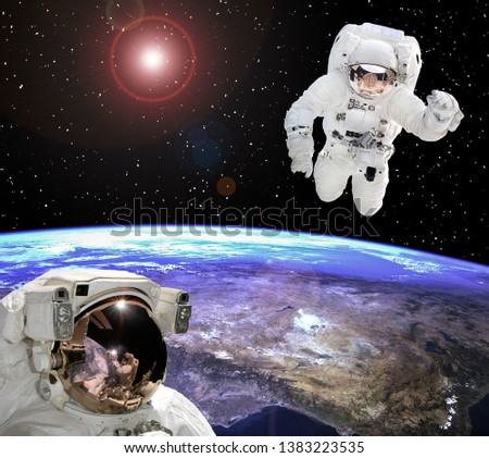 Astronaut staring at the astronaut. Scene above earth. The elements of this image furnished by NASA.
