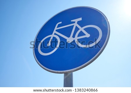 bike lane road sign with blue sky background