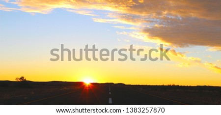 Sunset sky and road in the desert