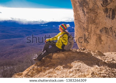 Beautiful amazing sunset.  Mountains in north country Russia Caucasus. Unique landscape mainsail.  Inspiring travel woman. Old nature cave. Active sport hobby. Spelunking quest panorama.
