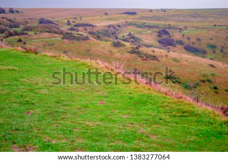 Green field on hill at dover and green area in england uk with meadows