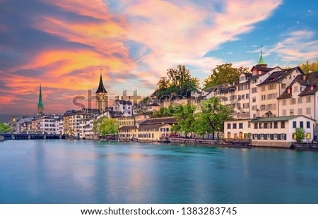 Scenic view of historic Zurich city center with famous Fraumunster and Grossmunster Churches and river Limmat at Lake Zurich, Canton of Zurich, Switzerland Royalty-Free Stock Photo #1383283745