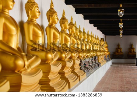 Golden yellow Buddha statue in Thailand