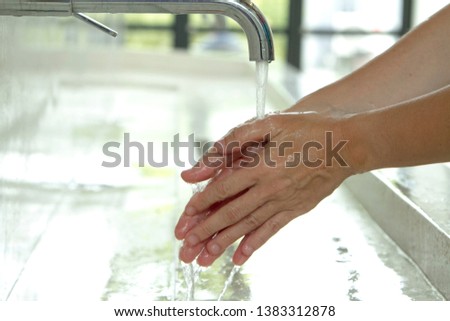 Close-up of hand washing for infection control and good hygiene Royalty-Free Stock Photo #1383312878