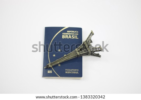passport of Brazil with a miniature of the Eiffel tower - travel from Brazil to Paris in France - Brazilian consulate in France - exchange from Brazil to France
- whit space for caption or text