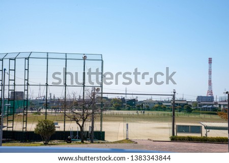 Baseball field inside the city of Nagoya, Japan.baseball, background, sport, team, field, ball,  game, vector, player, white, vintage, pitch, amateur, glove, batter, silhouette. Royalty-Free Stock Photo #1383343844