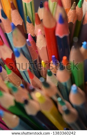 close up of colorful set wooden color pencil in isolated black and blur  background.