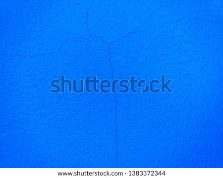 Cracked pattern on texture blue cement wall. Abstract blue surface.
