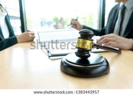 Judge or lawyer talking  with team or client about consult law detail, law firm concept.