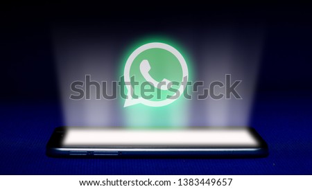 Magelang, Central Java, Indonesia, April 29, 2019.Hologram of whatsapp logo. hologram whatsapp logo image on blue background . The concept of next technology,social media, - Image Royalty-Free Stock Photo #1383449657