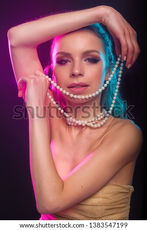 girl with jewelry in color light