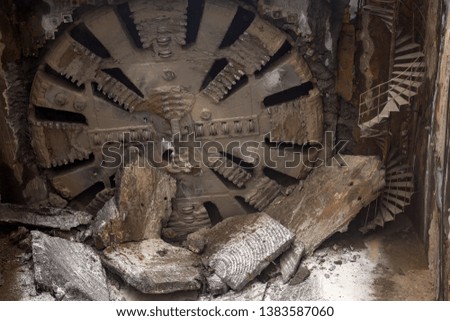 Tunnel Boring Machine front head element is seen on a subway station under construction.