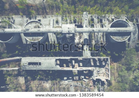 Aerial top view of abandoned industrial place. Photo made by drone from above.