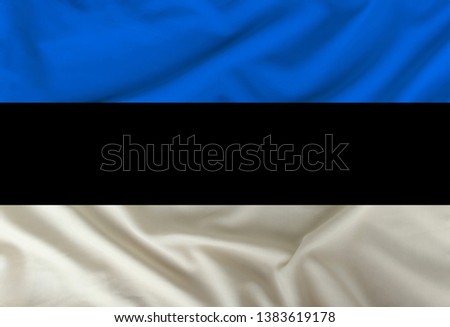 color estonia national flag on draped textile, background