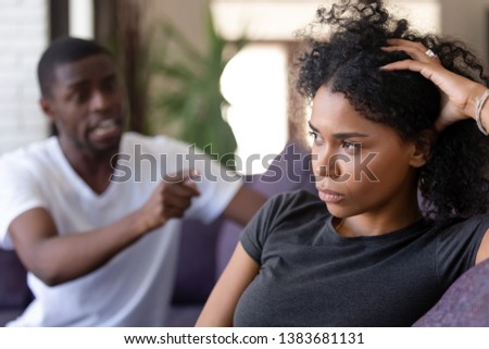 Mad emotional African American husband blame indifferent wife for relations troubles or separation, cold black woman ignore angry dissatisfied lover or boyfriend shouting, having fight or dispute Royalty-Free Stock Photo #1383681131