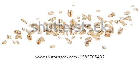Flying oat flakes isolated on white background with clipping path, falling oats collection, top view Royalty-Free Stock Photo #1383705482