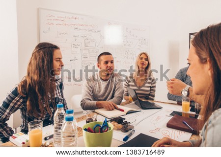 Group of young business people are having a meeting in the corporate office
