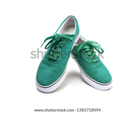 A pair of green canvas shoes isolated on white background with clipping path Royalty-Free Stock Photo #1383718094