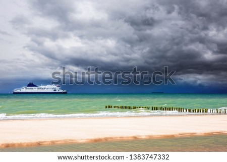 ferries sailing in front of Calais beaches
