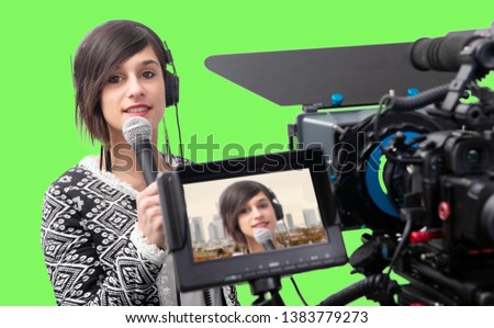 pretty young woman  journalist presenting report in television studio on green screen