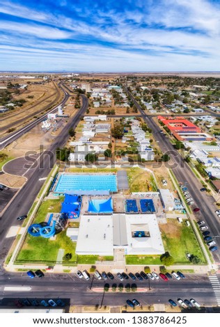 Popular holiday destination Moree town aquatic centre with hot artesian water from artesian basin in sports complex for relaxation and exercise for entire family. Royalty-Free Stock Photo #1383786425