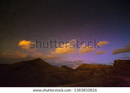 Beautiful landscape nightscape of a colorful starry night sky on the island Madeira at Ponta de Sao Lourenco nature reserve