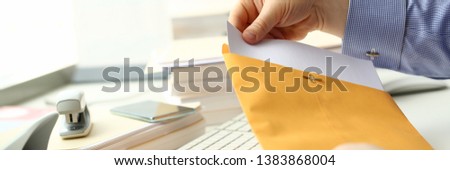 Businessman hold hand yellow mail envelope inbox post concept background